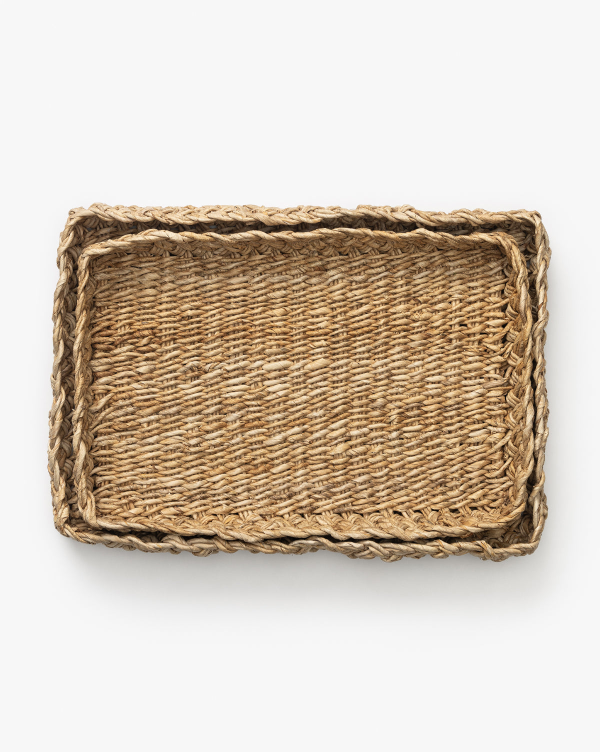 https://cdn.shopify.com/s/files/1/1496/0124/files/EudoraBraidedTray_Setof2_-MDCR3036-NAT-S-MAIN-T.jpg?v=1745946770